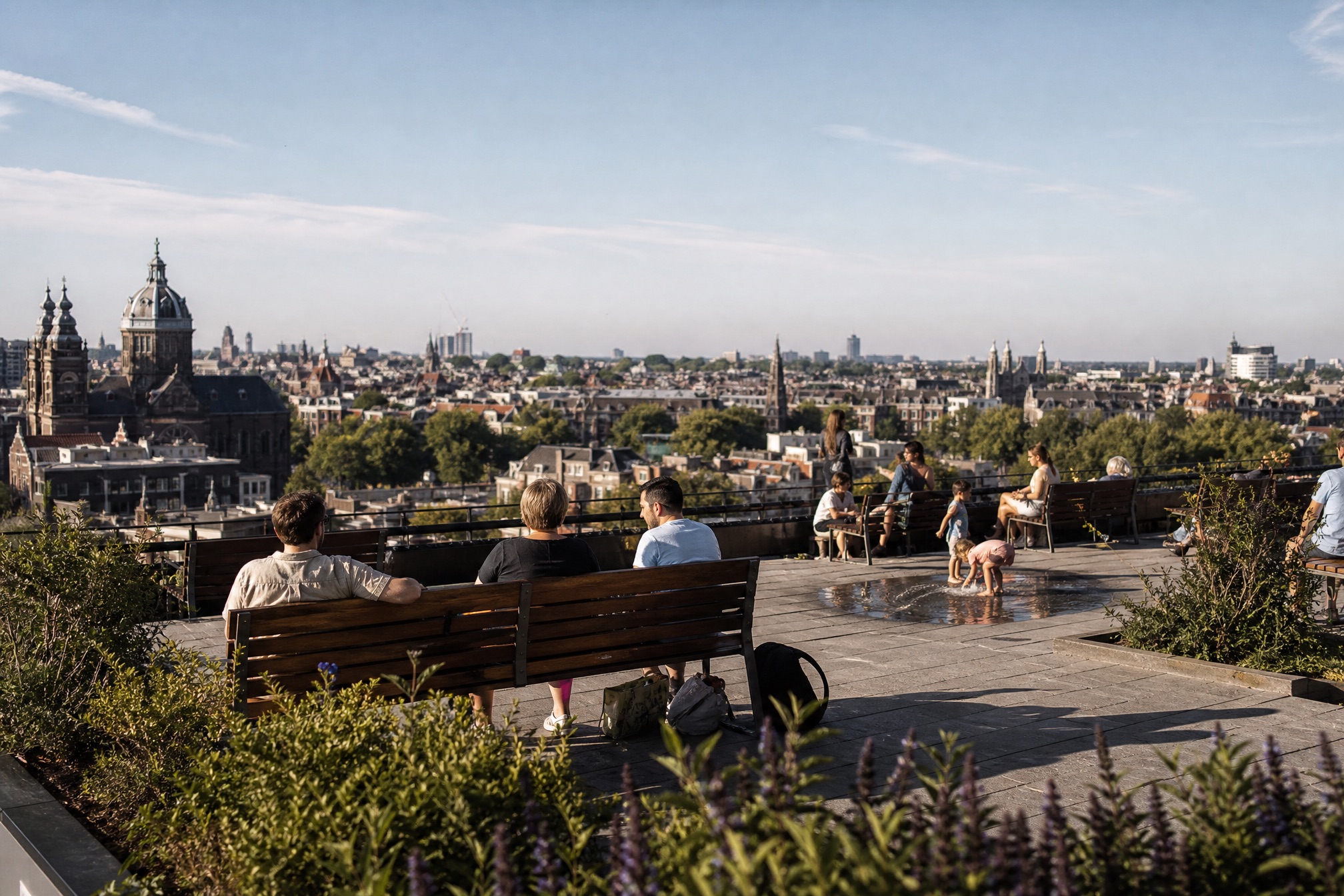 Families on the free NEMO rooftop square terrace overlooking Amsterdam
