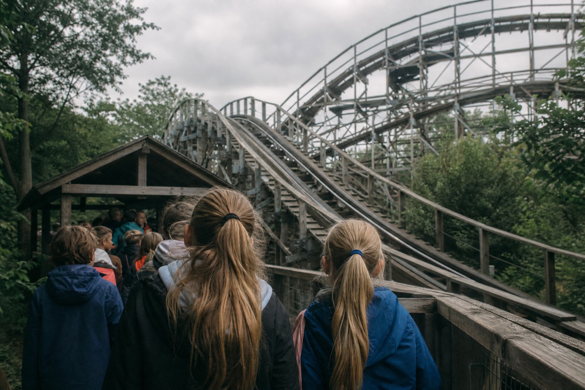 Children queueing for a wooden roller coaster at a Dutch theme park