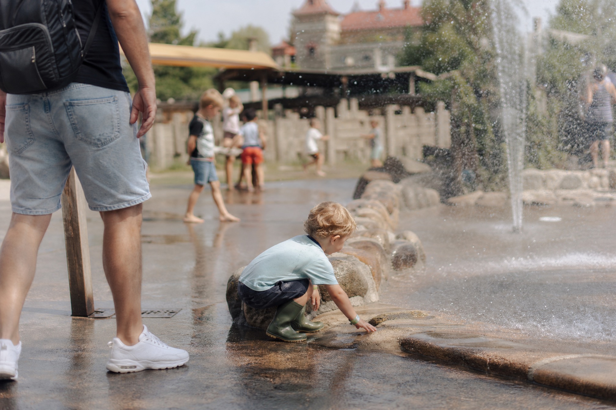 Toddler playing at a splash play area at a Dutch amusement park